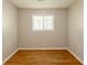 A bright bedroom featuring hardwood floors and a window with natural light at 4345 Kimball Sw Rd, Atlanta, GA 30331