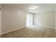 An empty bedroom featuring carpet and a sliding glass door at 4345 Kimball Sw Rd, Atlanta, GA 30331