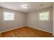 Bedroom featuring neutral walls, hardwood floors and natural light from two windows at 4345 Kimball Sw Rd, Atlanta, GA 30331