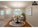 Staged dining room with hardwood floors, a decorative rug, and modern chandelier at 4345 Kimball Sw Rd, Atlanta, GA 30331