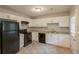 Bright kitchen featuring white cabinets, black appliances, and light countertops at 4345 Kimball Sw Rd, Atlanta, GA 30331