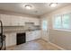 Cozy kitchen featuring ample white cabinetry, granite countertops, and stainless steel appliances at 4345 Kimball Sw Rd, Atlanta, GA 30331
