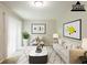 A staged living room featuring sofa, chairs, plants, and a marble coffee table at 4345 Kimball Sw Rd, Atlanta, GA 30331