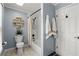 Clean bathroom with a bathtub, toilet, and white door at 4648 Equestrian Way, Atlanta, GA 30338