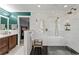 Nicely remodeled bathroom showcasing a walk-in shower, wood cabinet and modern fixtures at 4648 Equestrian Way, Atlanta, GA 30338