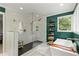 Spa-like bathroom with a glass enclosed shower and sleek soaking tub for a tranquil experience at 4648 Equestrian Way, Atlanta, GA 30338