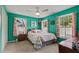 Comfortable bedroom featuring colorful walls, carpet, and two large windows at 4648 Equestrian Way, Atlanta, GA 30338