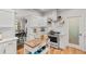 Charming eat-in kitchen with an island, stainless steel appliances, white cabinets, and access to the dining room at 4648 Equestrian Way, Atlanta, GA 30338