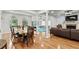 Open-concept living space with hardwood floors, fireplace, and large arched windows at 4648 Equestrian Way, Atlanta, GA 30338