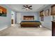 Spacious main bedroom with light blue walls, carpet flooring, ceiling fan, and lots of natural light at 4648 Equestrian Way, Atlanta, GA 30338