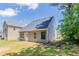 Spacious backyard featuring lush greenery and a well-manicured lawn at 4695 Ravenwood Loop, Union City, GA 30291