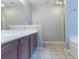 Bathroom featuring a vanity, bath tub, and tiled flooring at 4695 Ravenwood Loop, Union City, GA 30291
