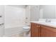 Bathroom showing combination tub and shower with modern vanity and neutral tones at 4695 Ravenwood Loop, Union City, GA 30291