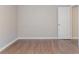 This bedroom features neutral walls and hardwood floors at 4695 Ravenwood Loop, Union City, GA 30291