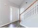 Entryway featuring hardwood floors, staircase, and bright white walls at 4695 Ravenwood Loop, Union City, GA 30291