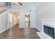 Living area with hardwood floors, fireplace, and staircase at 4695 Ravenwood Loop, Union City, GA 30291