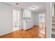 Basement features a sink, cabinets, hardwood floors, and a view of a small bathroom at 4770 Powers Park Ne Ct, Marietta, GA 30067