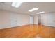 Large basement room with multiple closets and hardwood flooring at 4770 Powers Park Ne Ct, Marietta, GA 30067