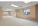 Bright basement with carpet, natural light, and an exit to the yard at 4770 Powers Park Ne Ct, Marietta, GA 30067