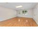Finished basement boasts hardwood floors, leading to an exterior door and large closet at 4770 Powers Park Ne Ct, Marietta, GA 30067