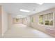 Basement area with carpet, drop ceiling and natural light at 4770 Powers Park Ne Ct, Marietta, GA 30067