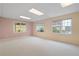 Large carpeted basement space with multiple windows offering natural light at 4770 Powers Park Ne Ct, Marietta, GA 30067