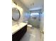 Modern bathroom with dark vanity, modern lighting, and a glass-enclosed shower at 4770 Powers Park Ne Ct, Marietta, GA 30067