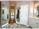 Bathroom featuring marble floors, vanity, and decorative mirrors at 4770 Powers Park Ne Ct, Marietta, GA 30067