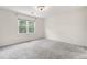 Bedroom with neutral carpeting, a large window, and neutral walls at 4770 Powers Park Ne Ct, Marietta, GA 30067