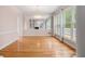 Spacious dining room with mirrored wall and floor-to-ceiling windows at 4770 Powers Park Ne Ct, Marietta, GA 30067
