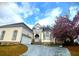 Home with a well-manicured lawn and a flowering tree adding to its curb appeal at 4770 Powers Park Ne Ct, Marietta, GA 30067