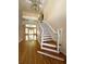Grand foyer with hardwood floors, staircase, and an elegant chandelier at 4770 Powers Park Ne Ct, Marietta, GA 30067