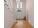 Entryway showcases hardwood floors, staircase, and double-door entrance at 4770 Powers Park Ne Ct, Marietta, GA 30067