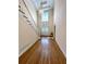Elegant foyer with hardwood floors, soaring ceilings, staircase, and a stylish pendant light fixture at 4770 Powers Park Ne Ct, Marietta, GA 30067