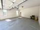 Spacious two car garage with windows, overhead lighting, and automatic door at 4770 Powers Park Ne Ct, Marietta, GA 30067