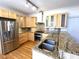 Modern kitchen with stainless steel appliances, granite countertops, and custom cabinetry at 4770 Powers Park Ne Ct, Marietta, GA 30067