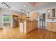 Open kitchen features light wood cabinets, stainless steel appliances, and granite countertops at 4770 Powers Park Ne Ct, Marietta, GA 30067