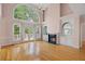 Elegant living room featuring a fireplace, built-in shelving, and a soaring ceiling at 4770 Powers Park Ne Ct, Marietta, GA 30067
