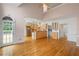 Open-concept space with kitchen, dining and hardwood floors illuminated with natural light at 4770 Powers Park Ne Ct, Marietta, GA 30067