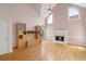 Bright living room with vaulted ceilings, large windows, hardwood floors, and a fireplace at 4770 Powers Park Ne Ct, Marietta, GA 30067