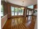 Spacious living area with gleaming hardwood floors, large windows, and elegant columns at 4770 Powers Park Ne Ct, Marietta, GA 30067