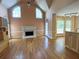 Open living room with a fireplace and large windows for plenty of natural light at 4770 Powers Park Ne Ct, Marietta, GA 30067