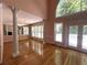 Bright living room showcasing hardwood floors, columns, and a large arched window at 4770 Powers Park Ne Ct, Marietta, GA 30067