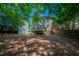 Backyard view with mature foliage and multi-tiered decks on homes at 6509 Charter Way, Lithonia, GA 30058