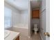 Bathroom with bathtub, toilet, and cabinet at 6509 Charter Way, Lithonia, GA 30058