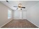 Bedroom with neutral paint, a ceiling fan, and a window at 6509 Charter Way, Lithonia, GA 30058
