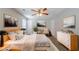 Bright bedroom featuring neutral walls, ceiling fan, and modern furnishings at 6509 Charter Way, Lithonia, GA 30058