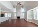 Bright and airy living room with high ceilings, fireplace, and large windows offering plenty of natural light at 6509 Charter Way, Lithonia, GA 30058