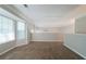 Upstairs living room with carpet, fan, and a window at 6509 Charter Way, Lithonia, GA 30058