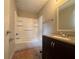 This bathroom includes a shower-tub combination and a vanity with storage at 6668 Prinston Cir, Douglasville, GA 30135